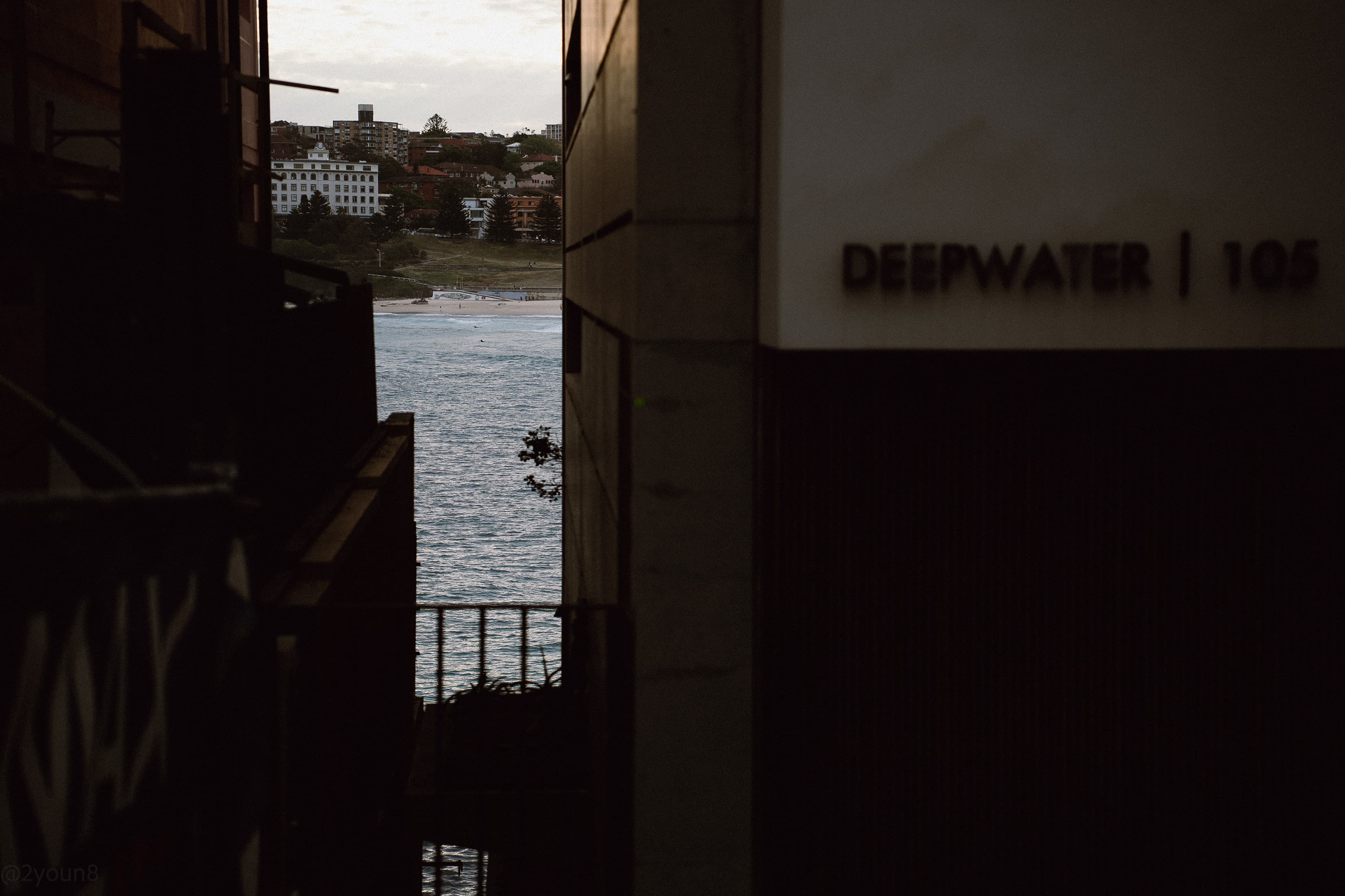 Gap between buildings framing a view of the ocean